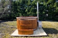 Wooden hot tub with steps