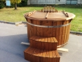 Old fashioned new stainless steel wooden hot tub