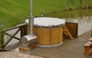 Old fasion outdoor wooden hot tub with cover