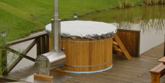 Old fasion outdoor wooden hot tub with cover