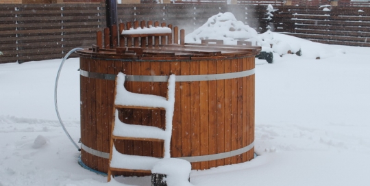 Garden outdoor wooden hot tub in winter